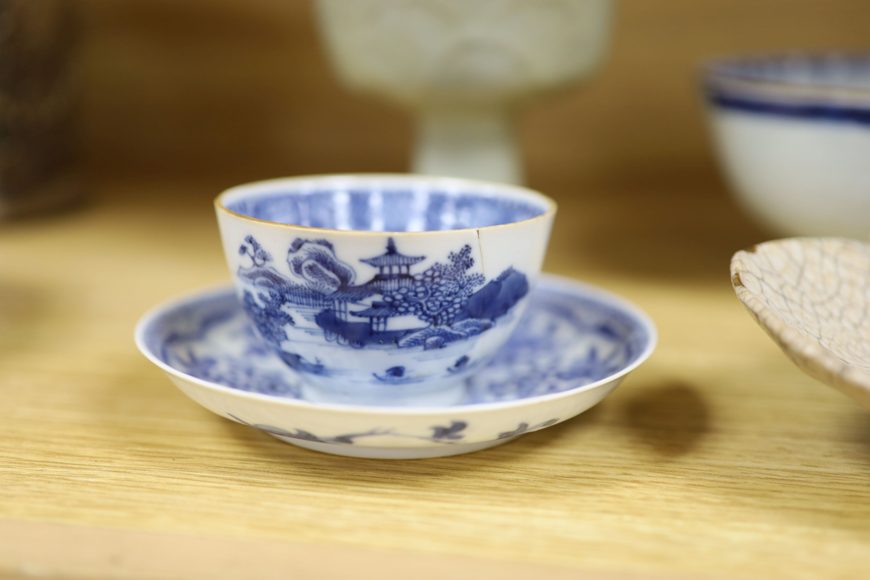 A Chinese blue and white bowl, diameter 15cm, a tea bowl and saucer, a crackleglaze shell dish and a celadon glazed stem cup